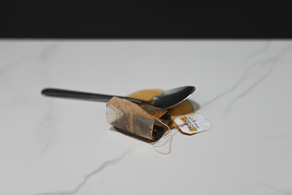 Spilled Tea with Spoon and Tea Bag