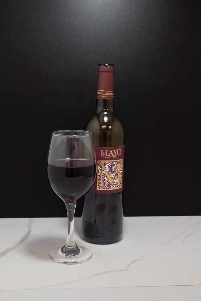 Half Filled Red Wine Bottle