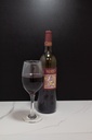 Half Filled Red Wine Bottle