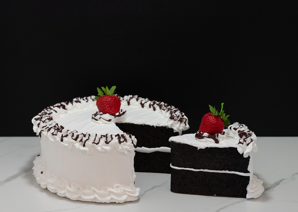 Large Vanilla Frosted Cake with Missing Slice