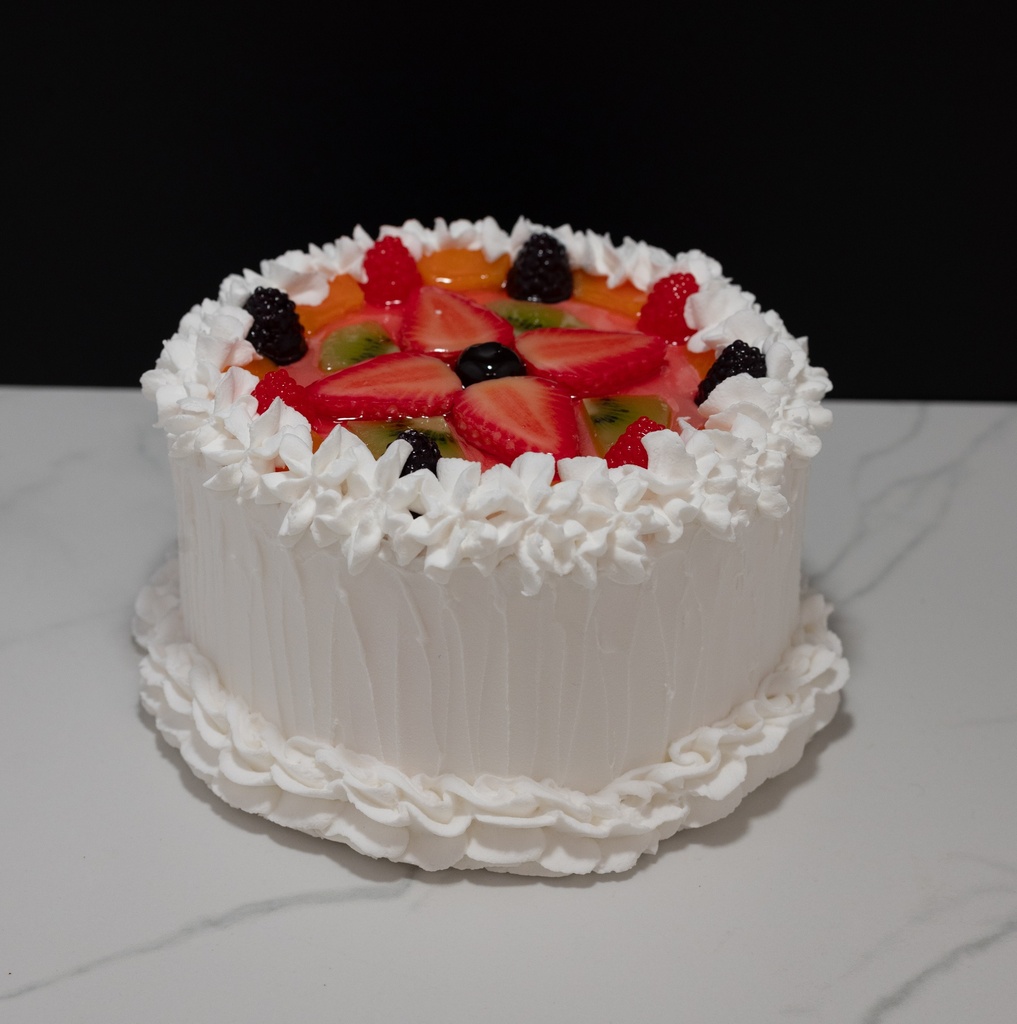 Small Vanilla Frosted Cake Topped with Fruit