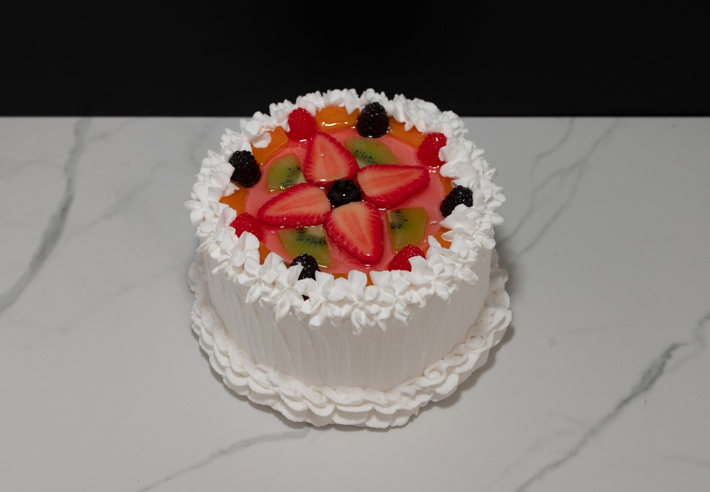 Small Vanilla Frosted Cake Topped with Fruit