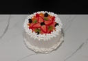 Small Vanilla Frosted Cake Topped with Fruit
