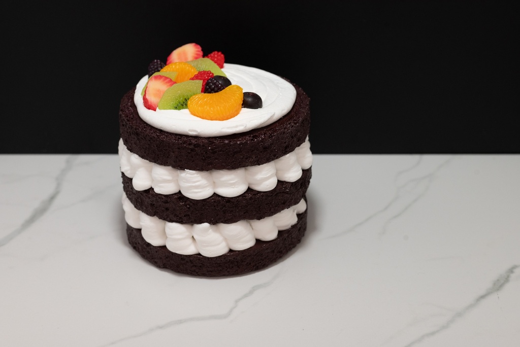 Triple Layer Chocolate Cake Topped with Fruit