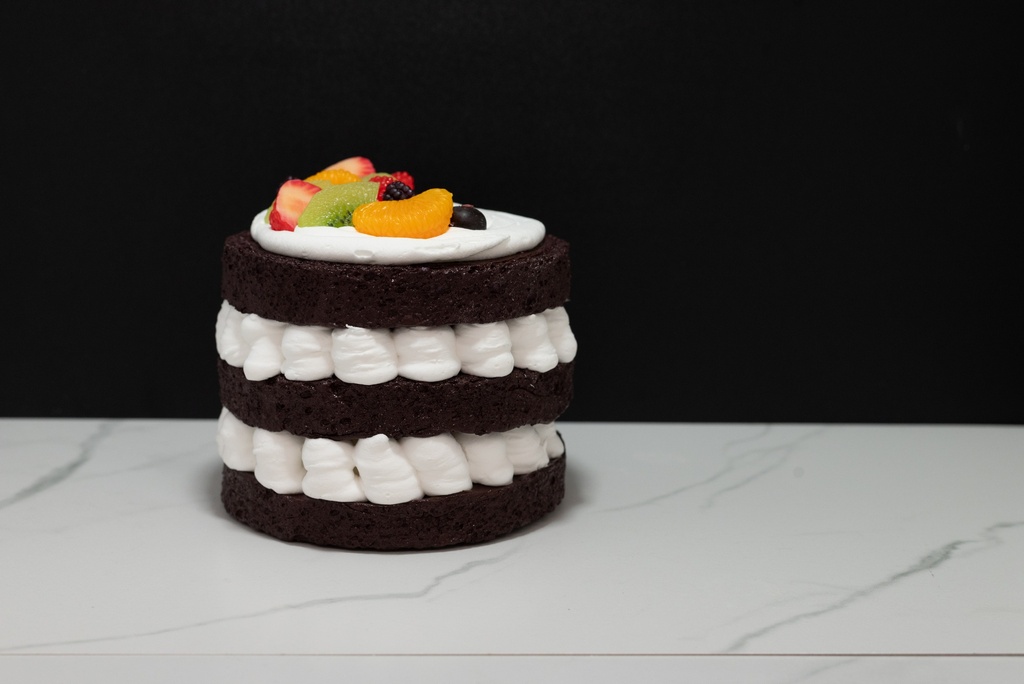 Triple Layer Chocolate Cake Topped with Fruit