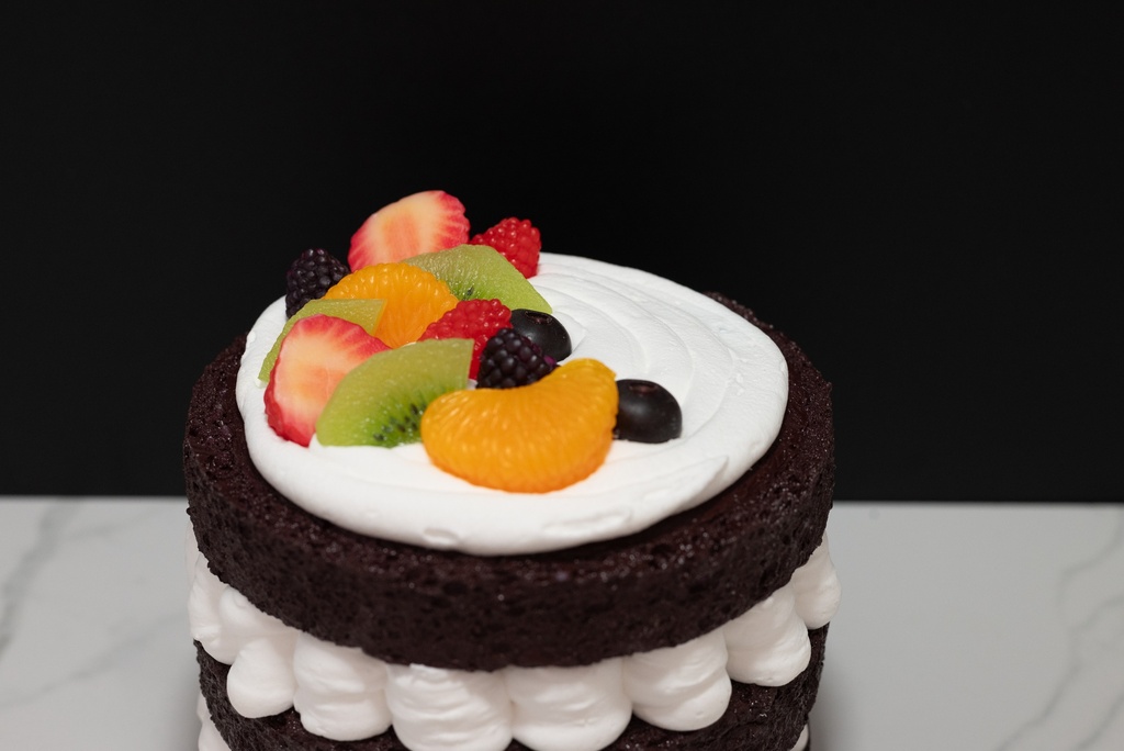 Triple Layer Chocolate Cake Topped with Fruit