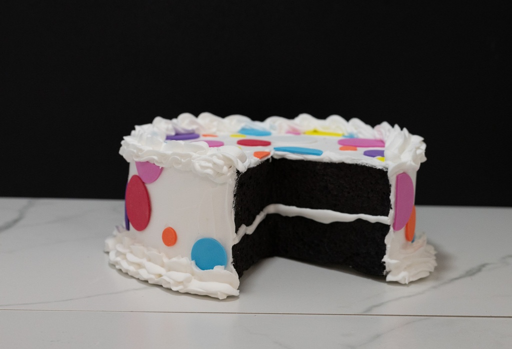 Large Multicolored Polka Dot Cake with Missing Slice