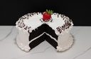 Large Vanilla Frosted Cake with Missing Slice