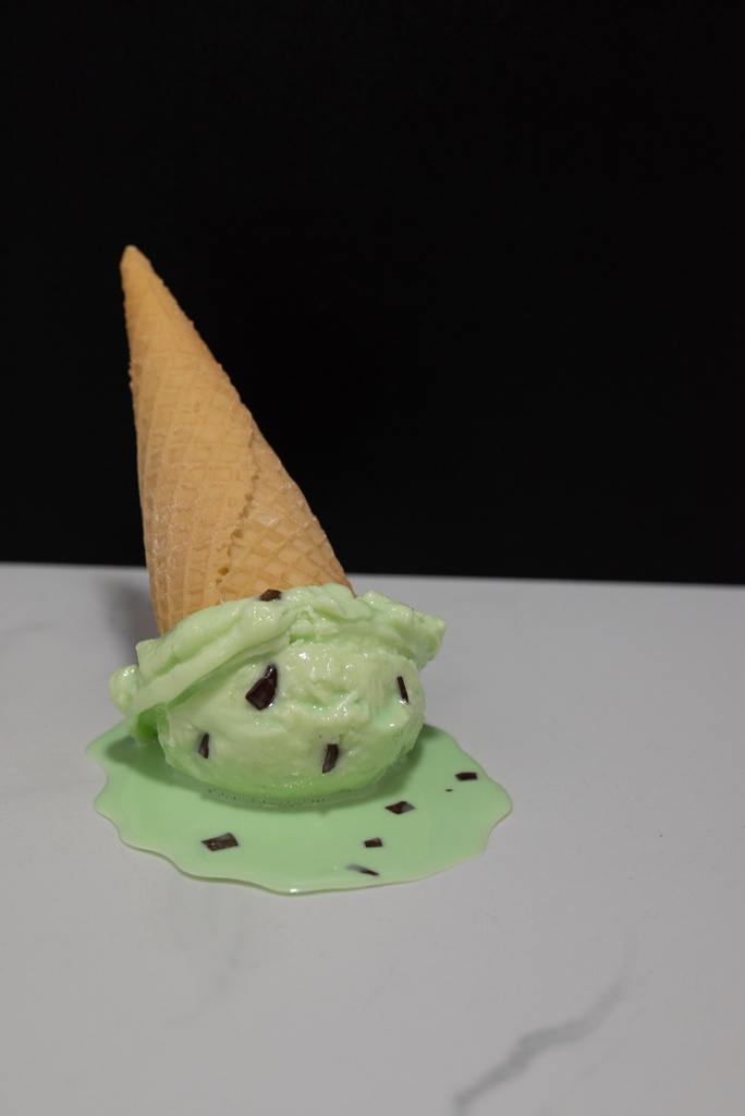 Melting Mint Chocolate Chip Ice Cream Cone