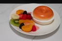 Plated Bagel with Cream Cheese and Fruit