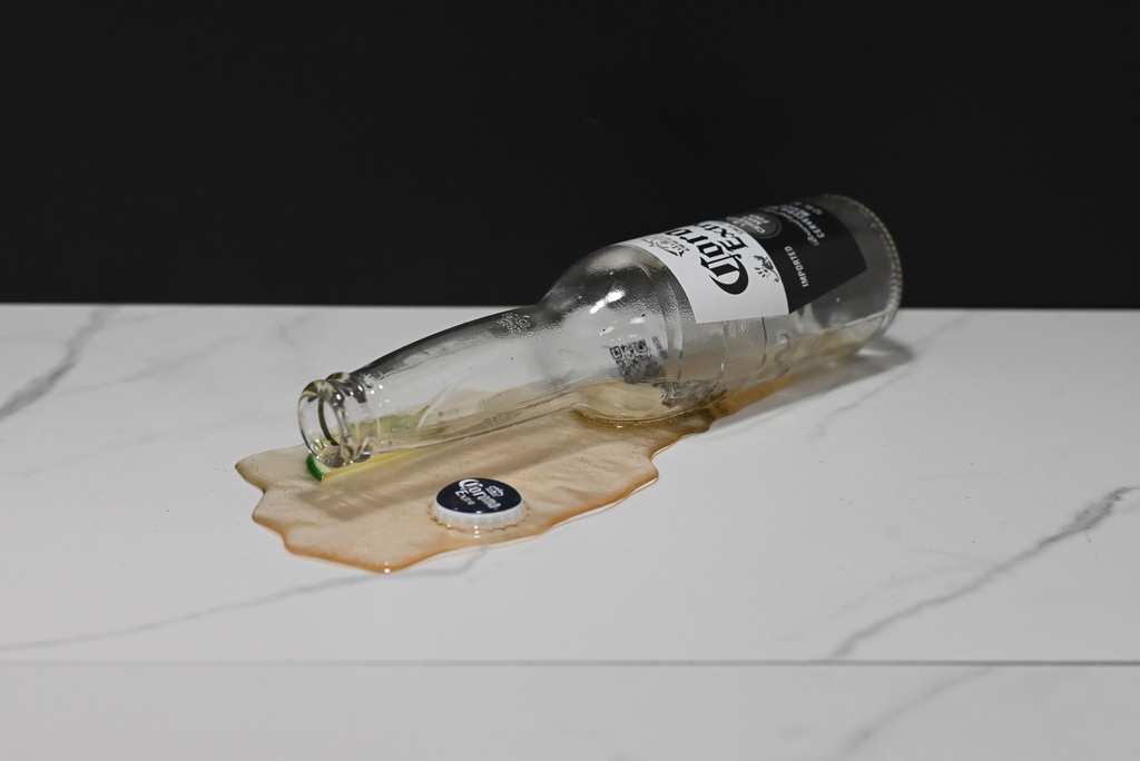 Spilled Beer Bottle with Lime