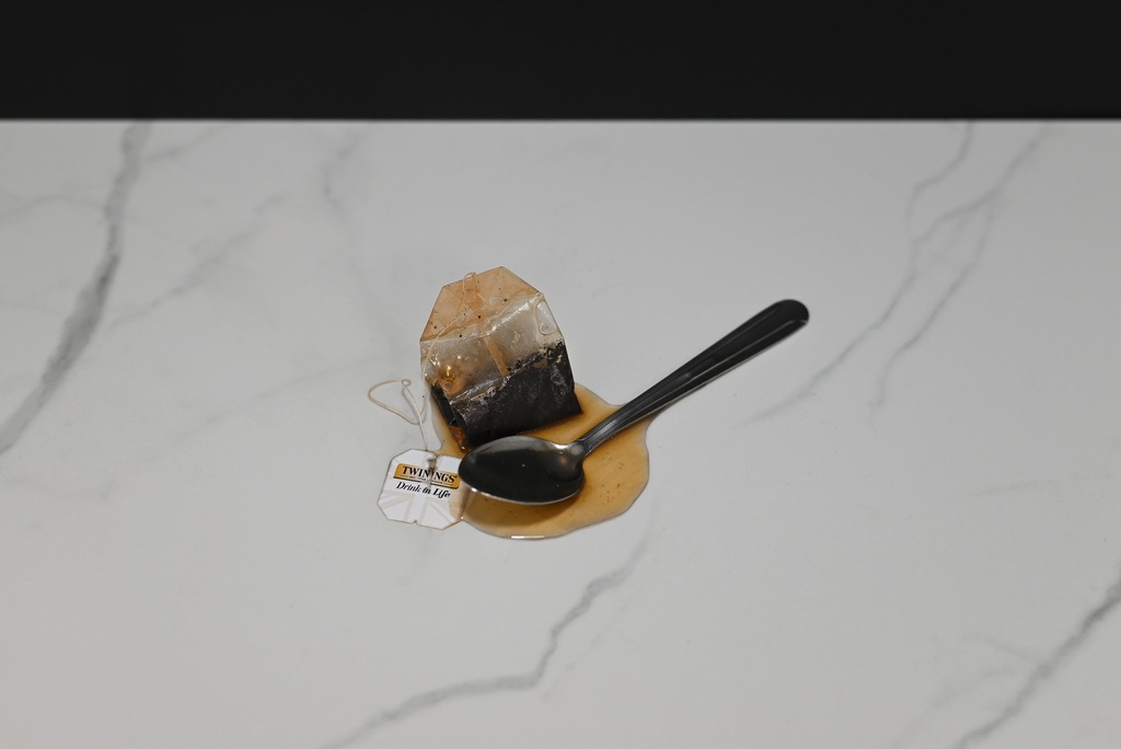 Spilled Tea with Spoon and Tea Bag